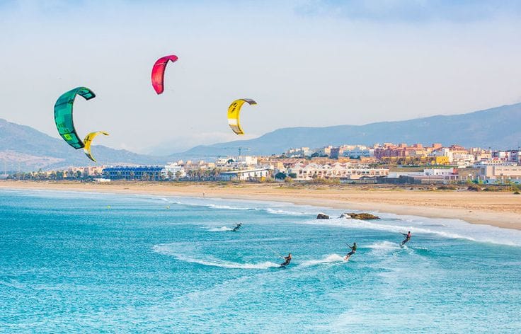 Phan Thiet Kitesurfing – Kitesurfer riding waves along the Phan Thiet coast in Vietnam.