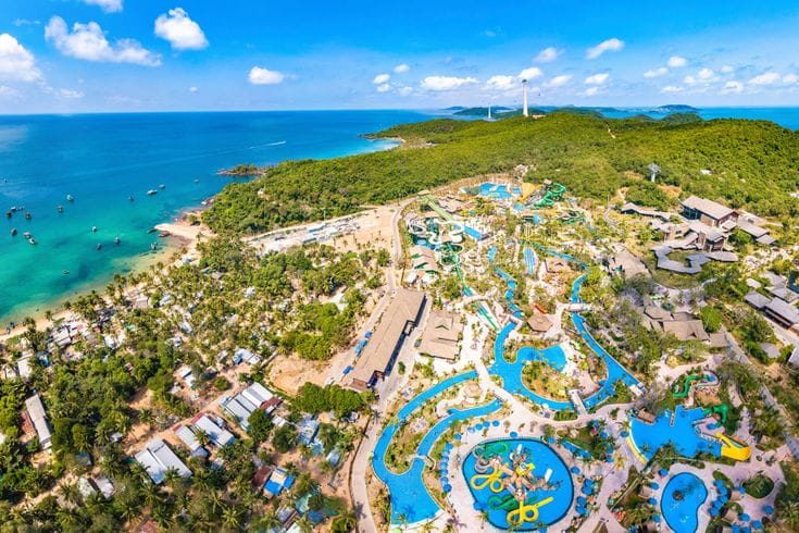 Phu Quoc Diving – Scuba diver swimming with coral reef and tropical fish in Phu Quoc, Vietnam.
